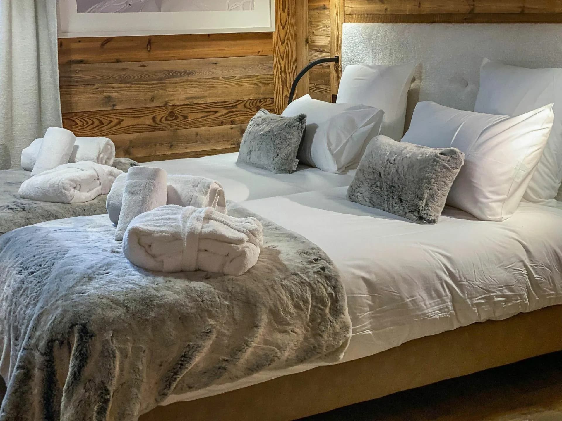 Guest bedroom with king bed; includes robes and reading lamps
