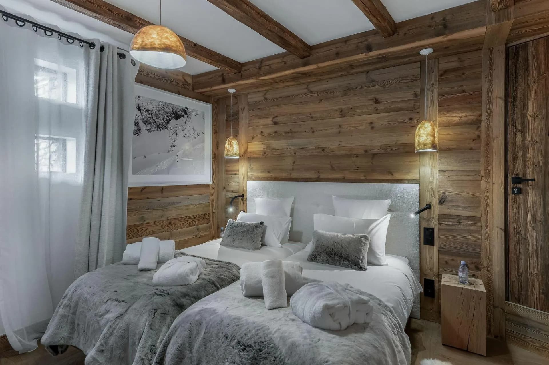 Guest bedroom with two twin beds and reading lights