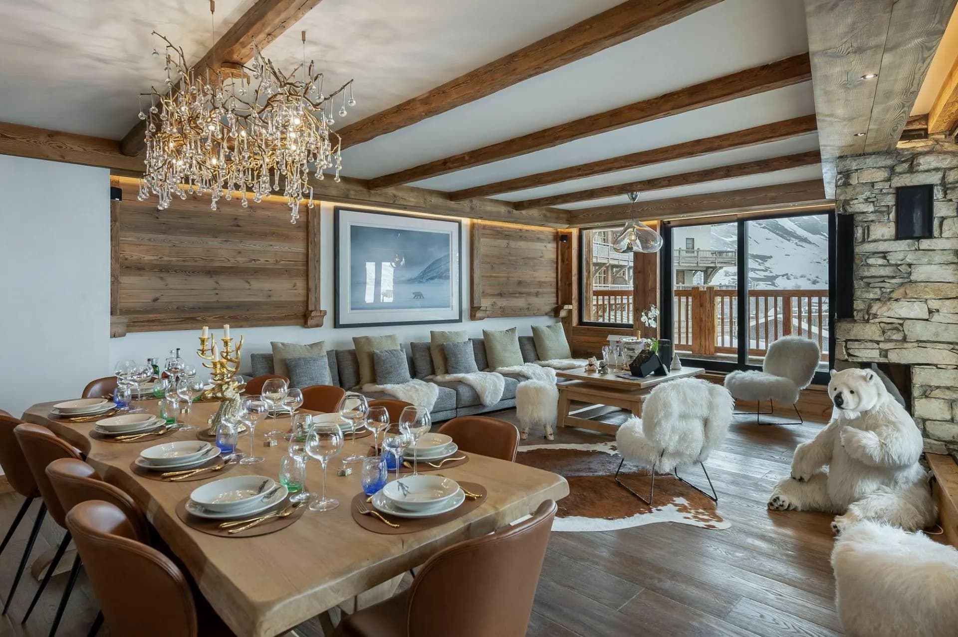 Open-plan dining and living area; table seats 12 with mountain views