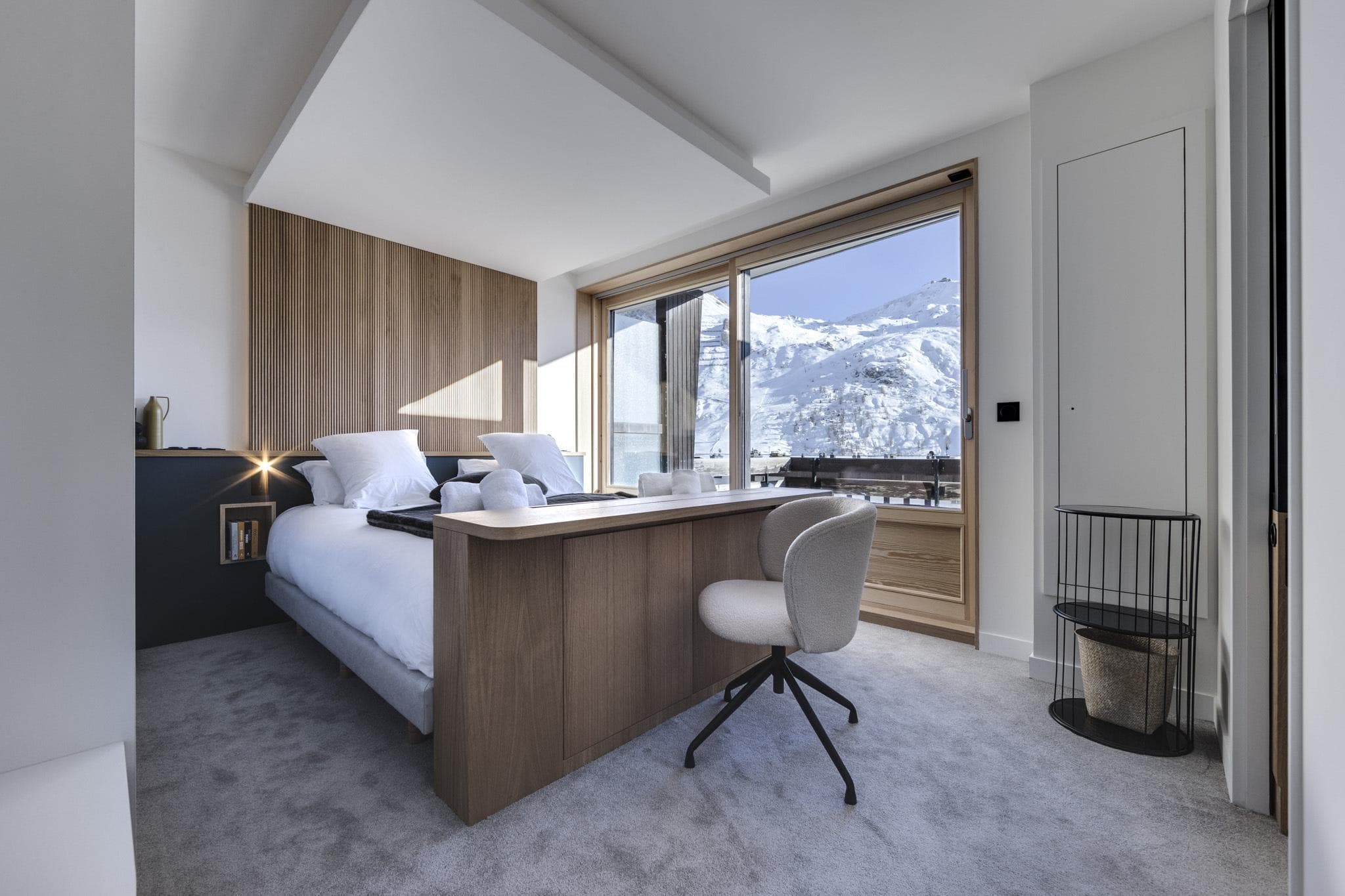 Bedroom with integrated desk and mountain views