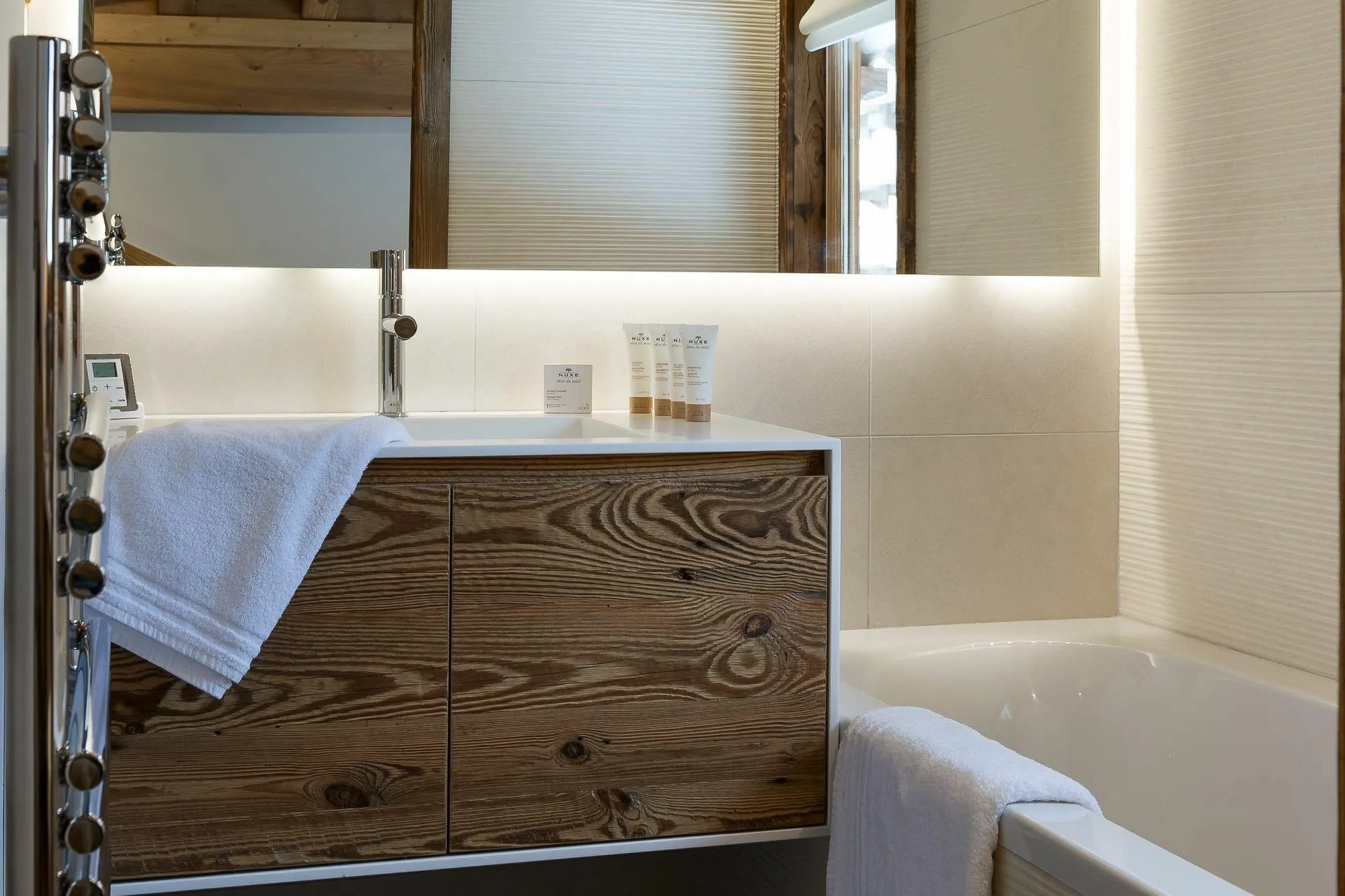 Bathroom featuring soaking tub and heated towel rail
