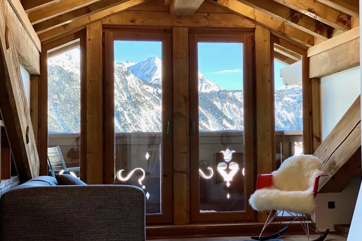 Top floor lounge with mountain views and private balcony access