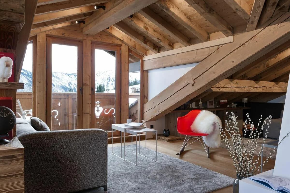 Attic sitting area with mountain views and balcony access