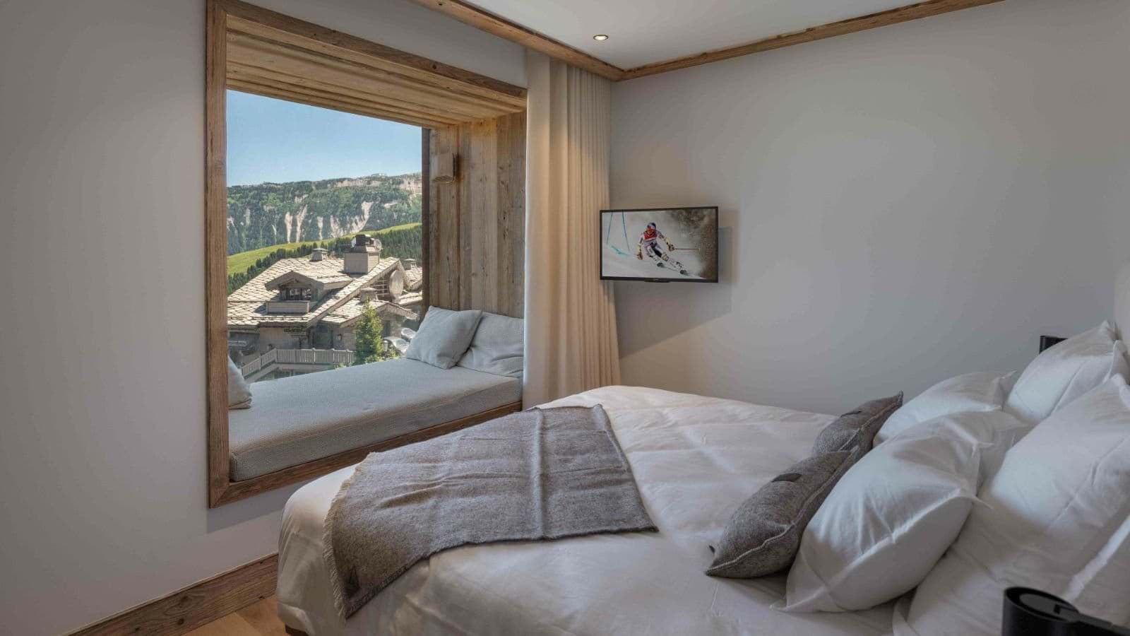 Guest bedroom with reading nook and mountain views