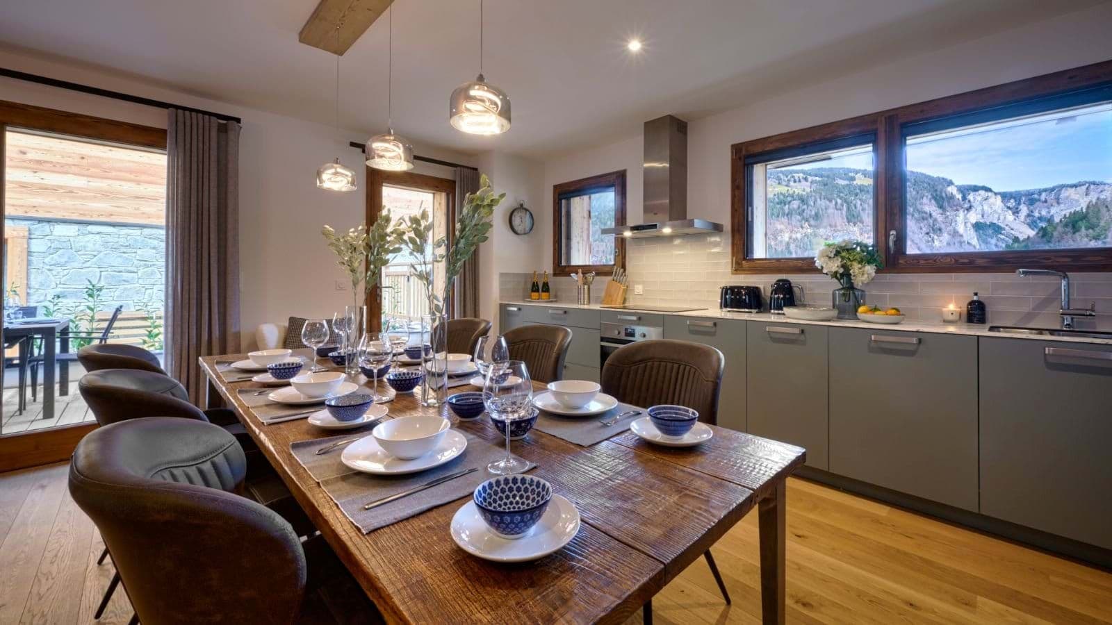 Open-plan dining area for 8 with mountain views and patio access