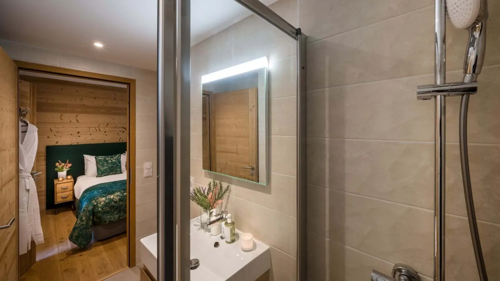 En-suite shower room with a glass enclosure and vanity basin