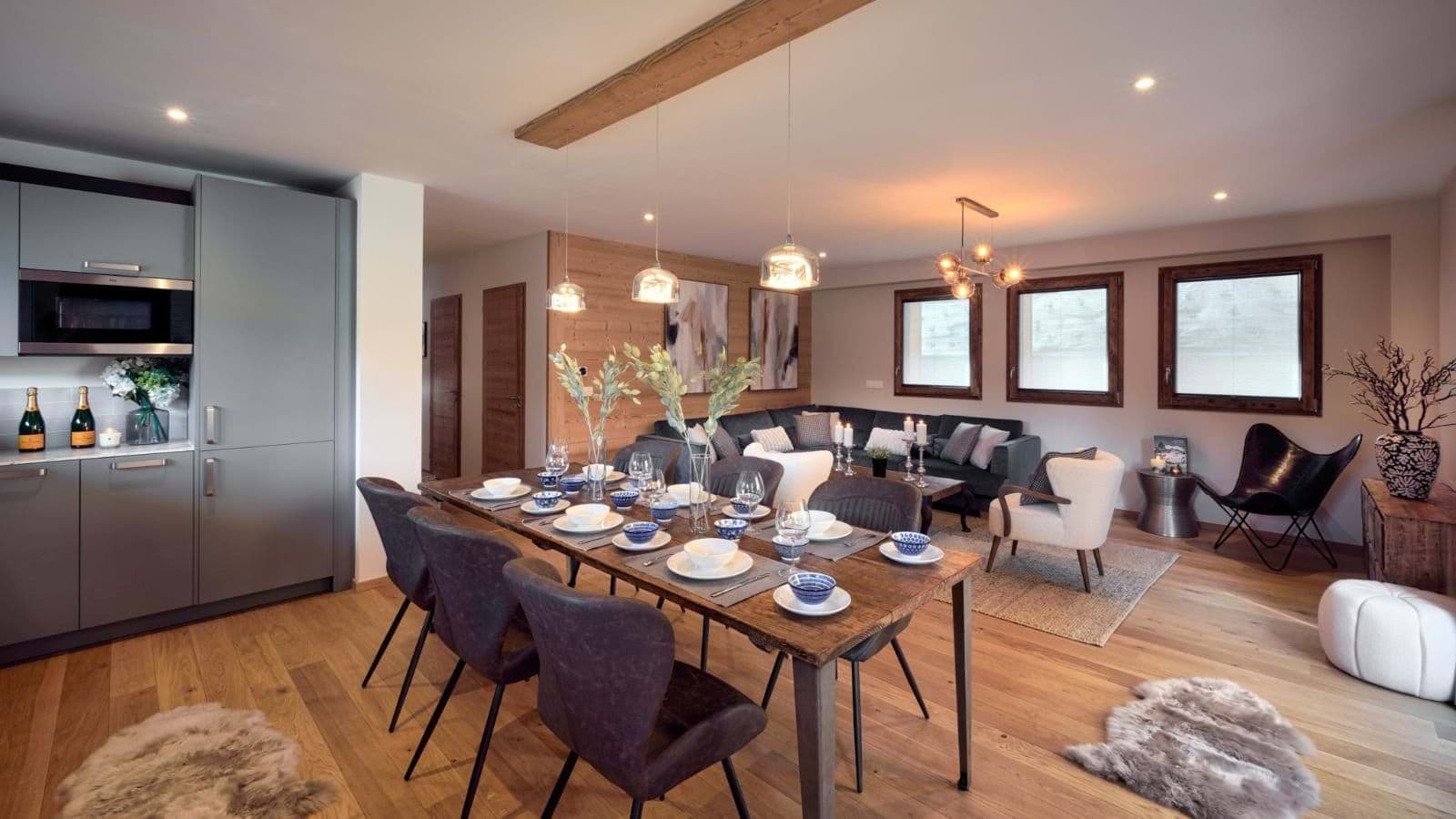 Open-plan kitchen, dining and living area with terrace access