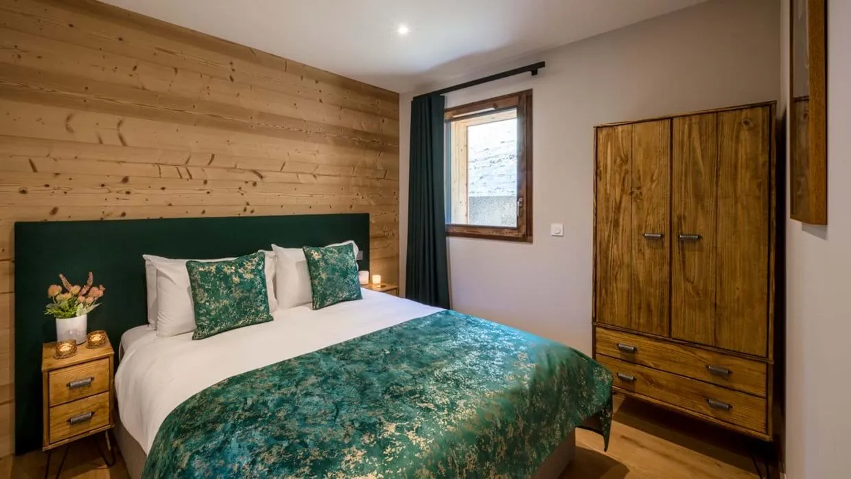 Double bedroom with a timber wardrobe