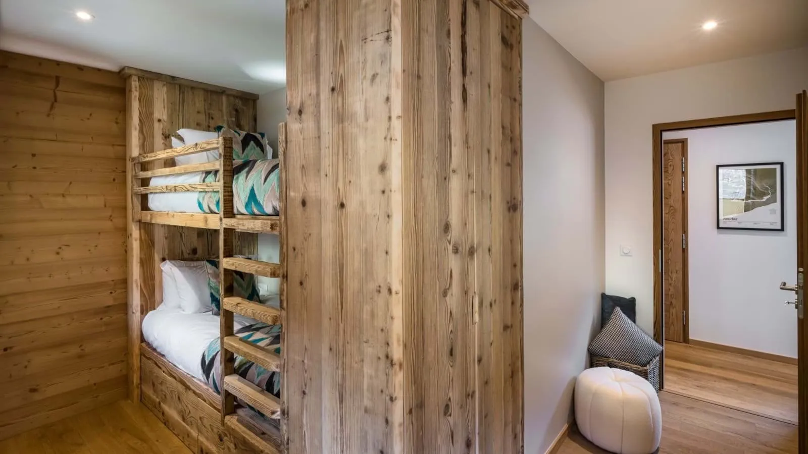 Bunk bedroom with two single beds and built-in storage