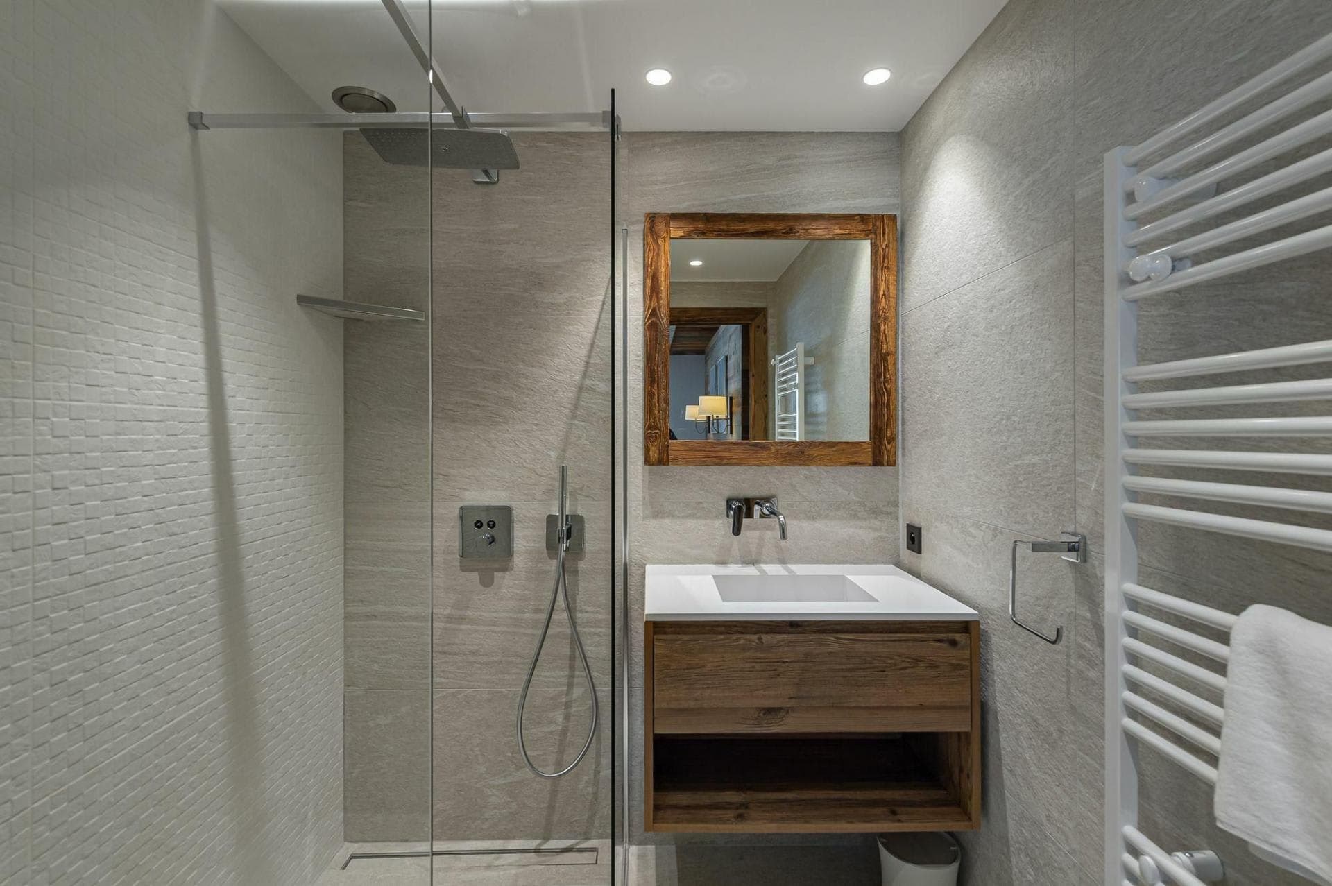 Bathroom with walk-in rain shower and heated towel rail