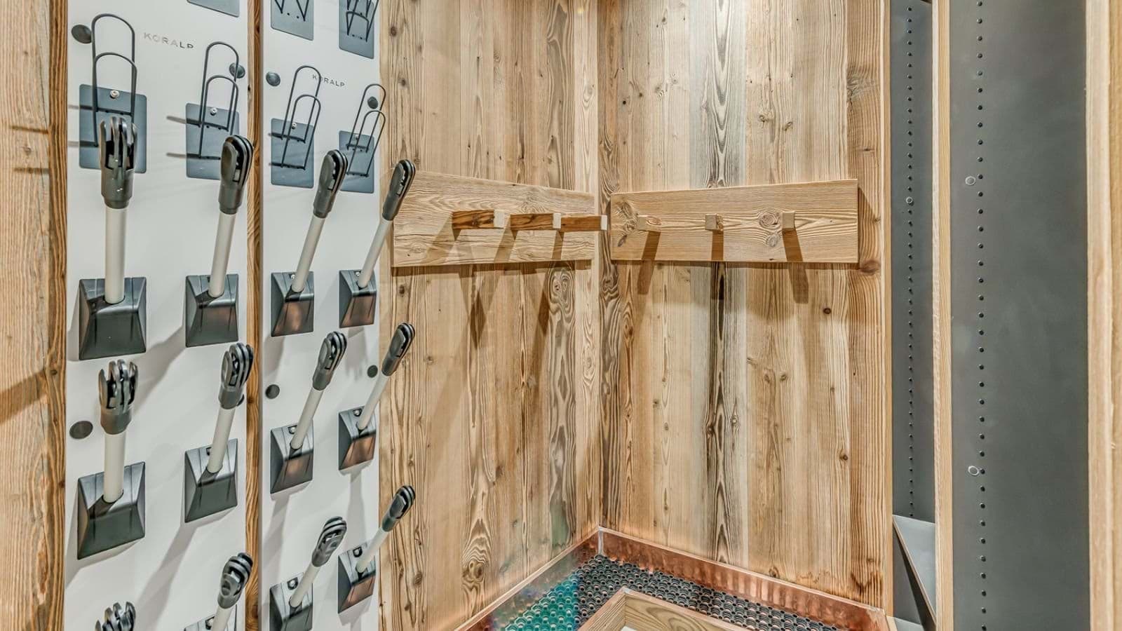 Ski room with heated boot dryers and gear storage racks