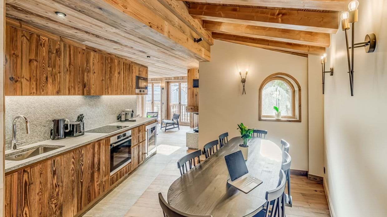 Kitchen with wine cooler and dining table for eight