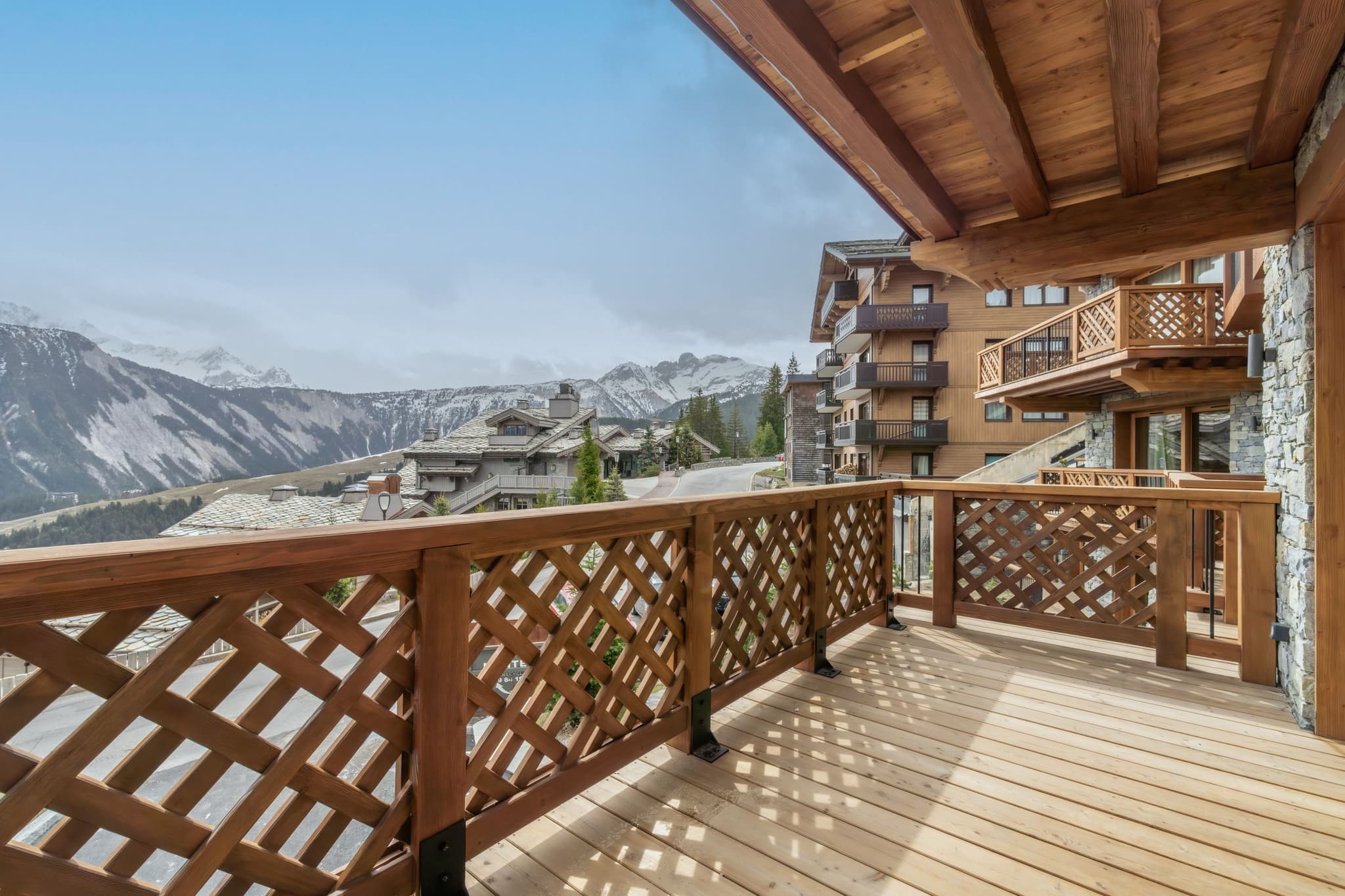 Private timber balcony with panoramic mountain and valley views
