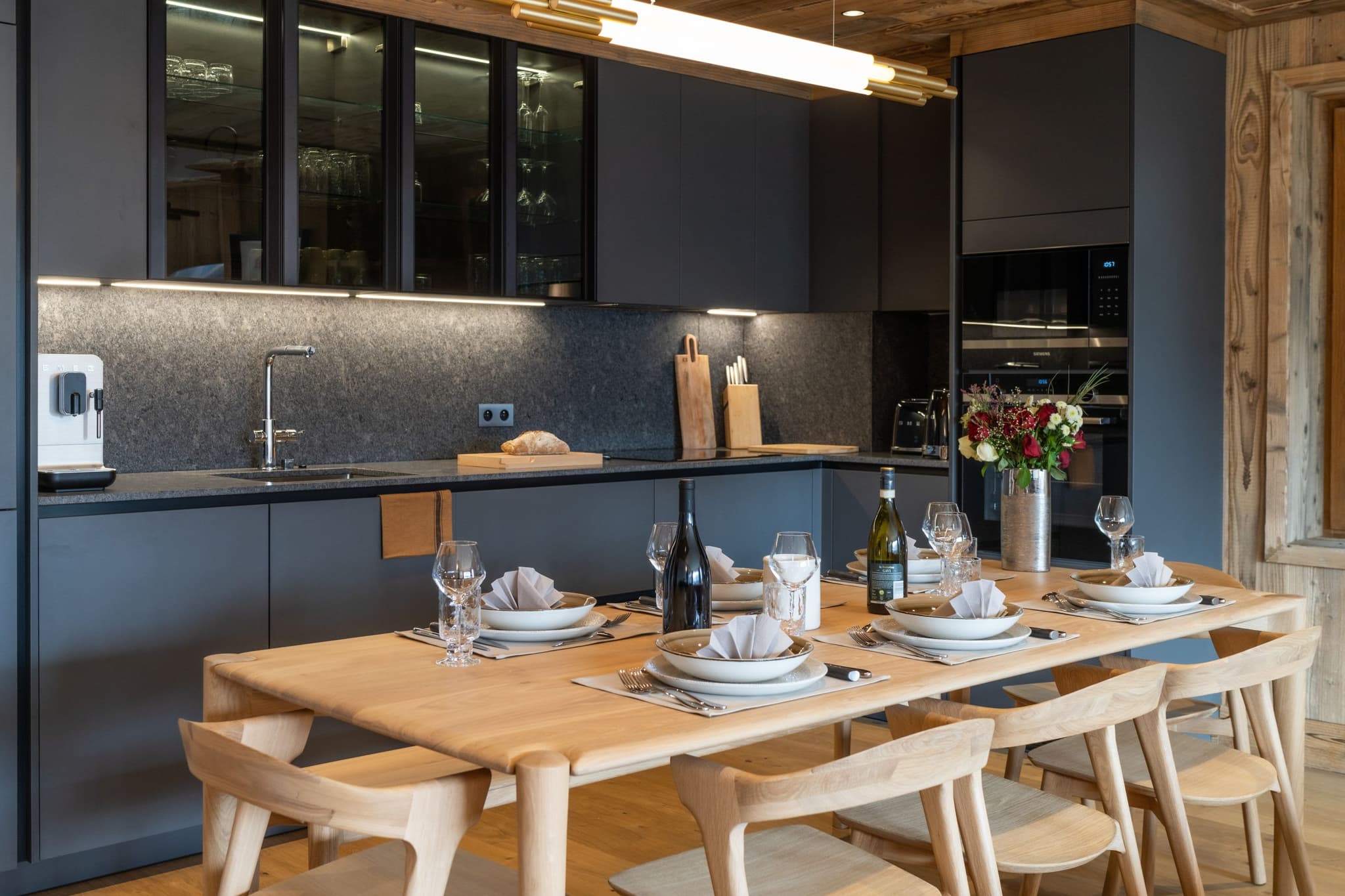 Kitchen and dining area with Siemens wall oven and seating for 8