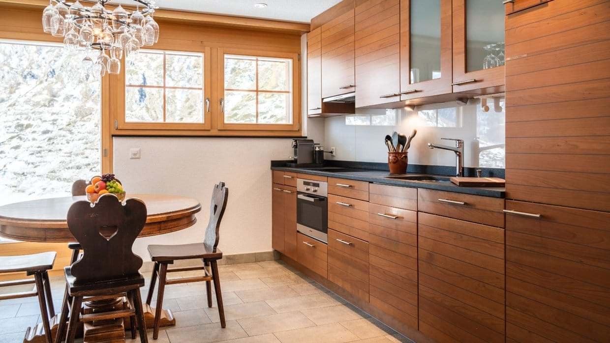 Kitchen with wood cabinetry, Nespresso machine, and mountain views