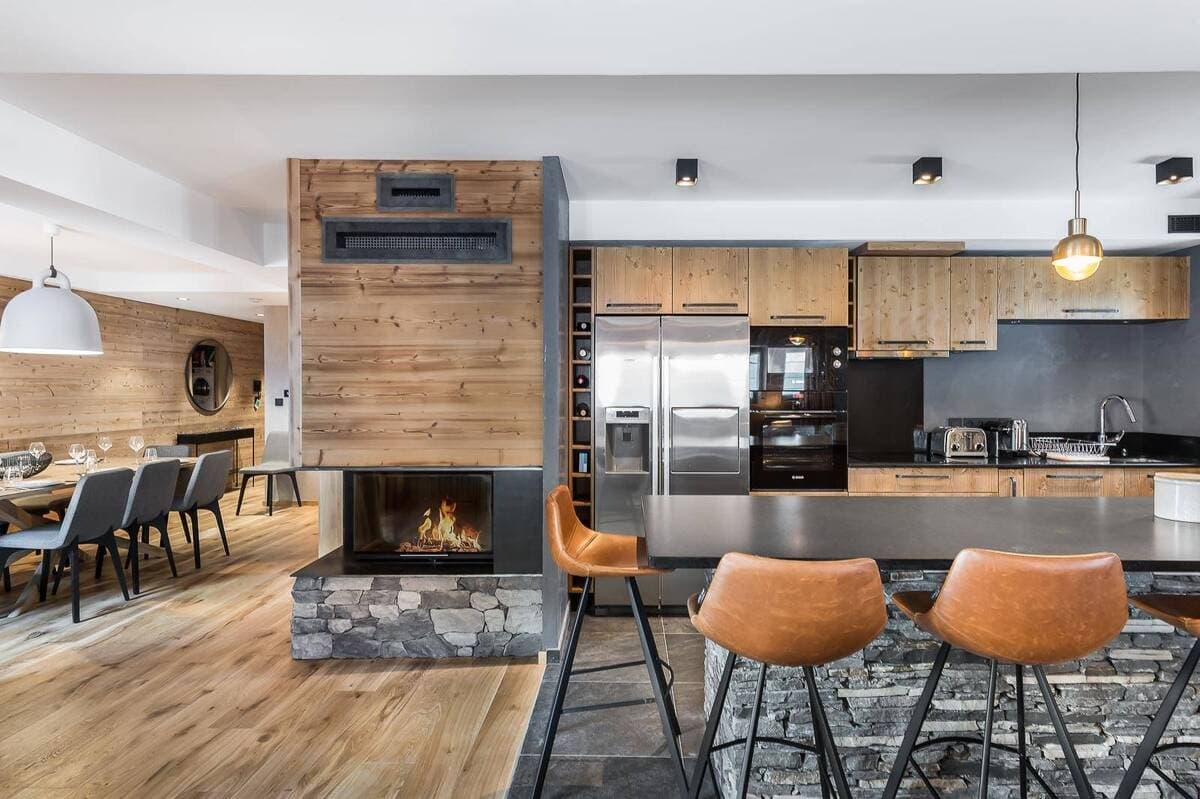 Kitchen with stone breakfast bar and wood-burning fireplace
