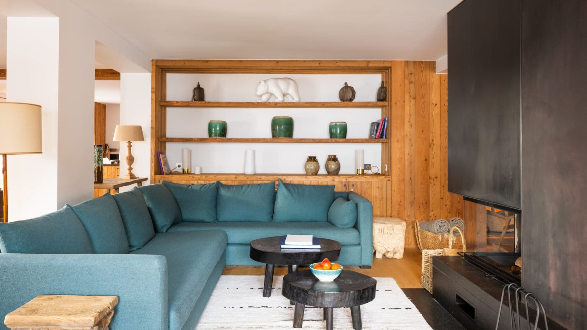 Living room with L-shaped sectional sofa and wood-burning fireplace