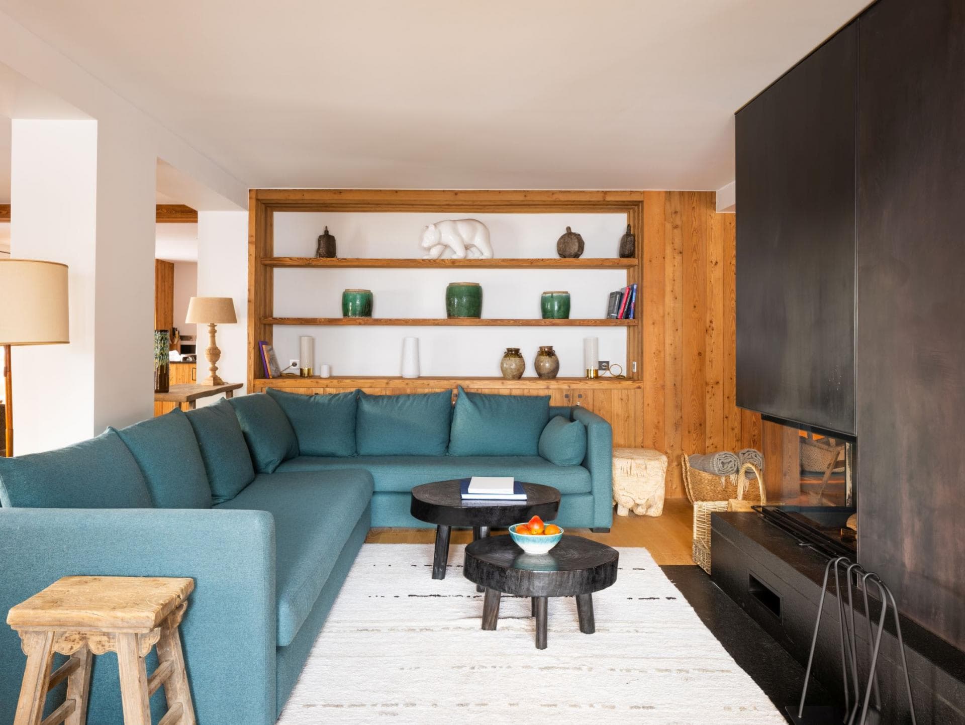 Living area with wood-burning fireplace and sectional seating for six