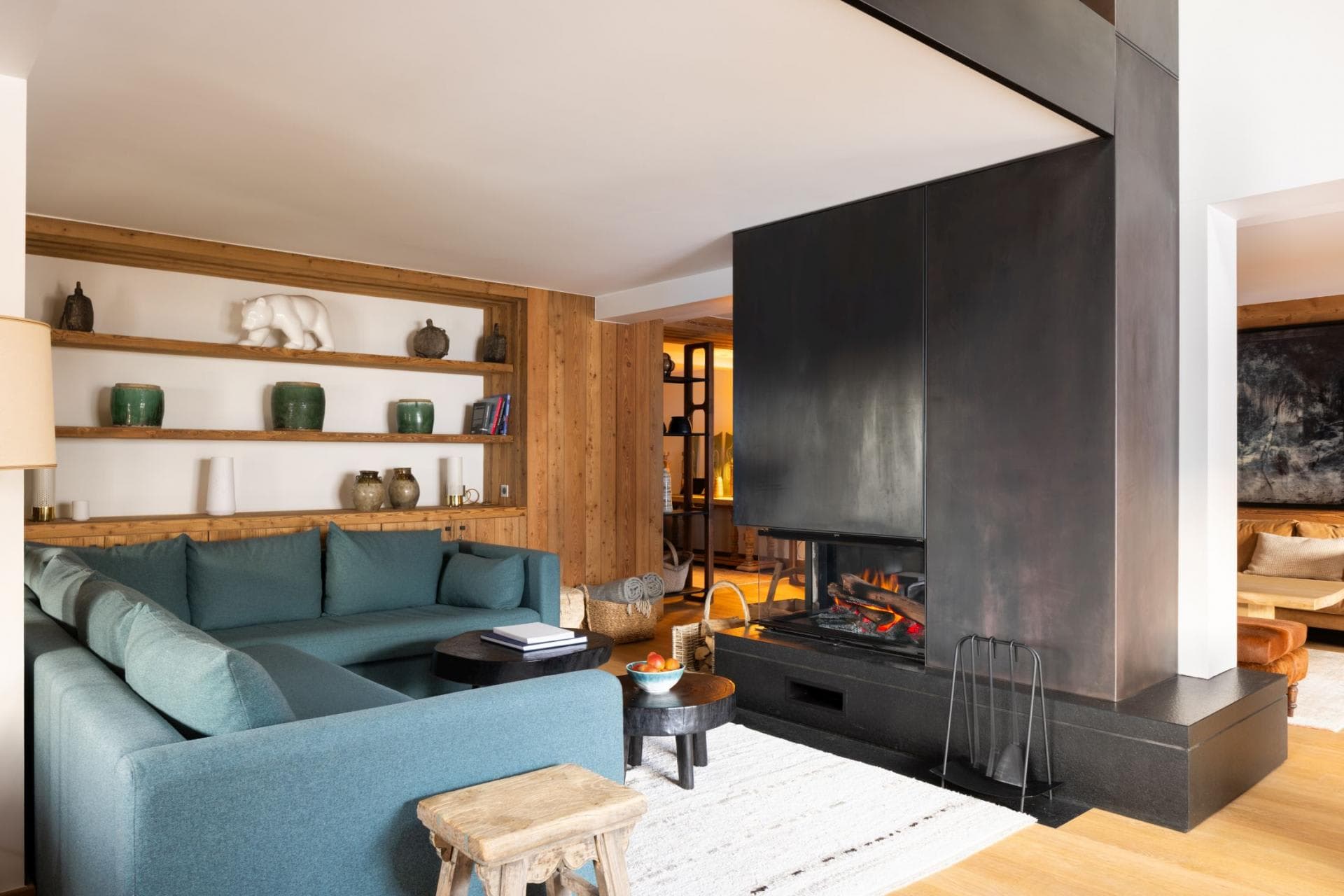 Living area with wood-burning fireplace and sectional seating for 5