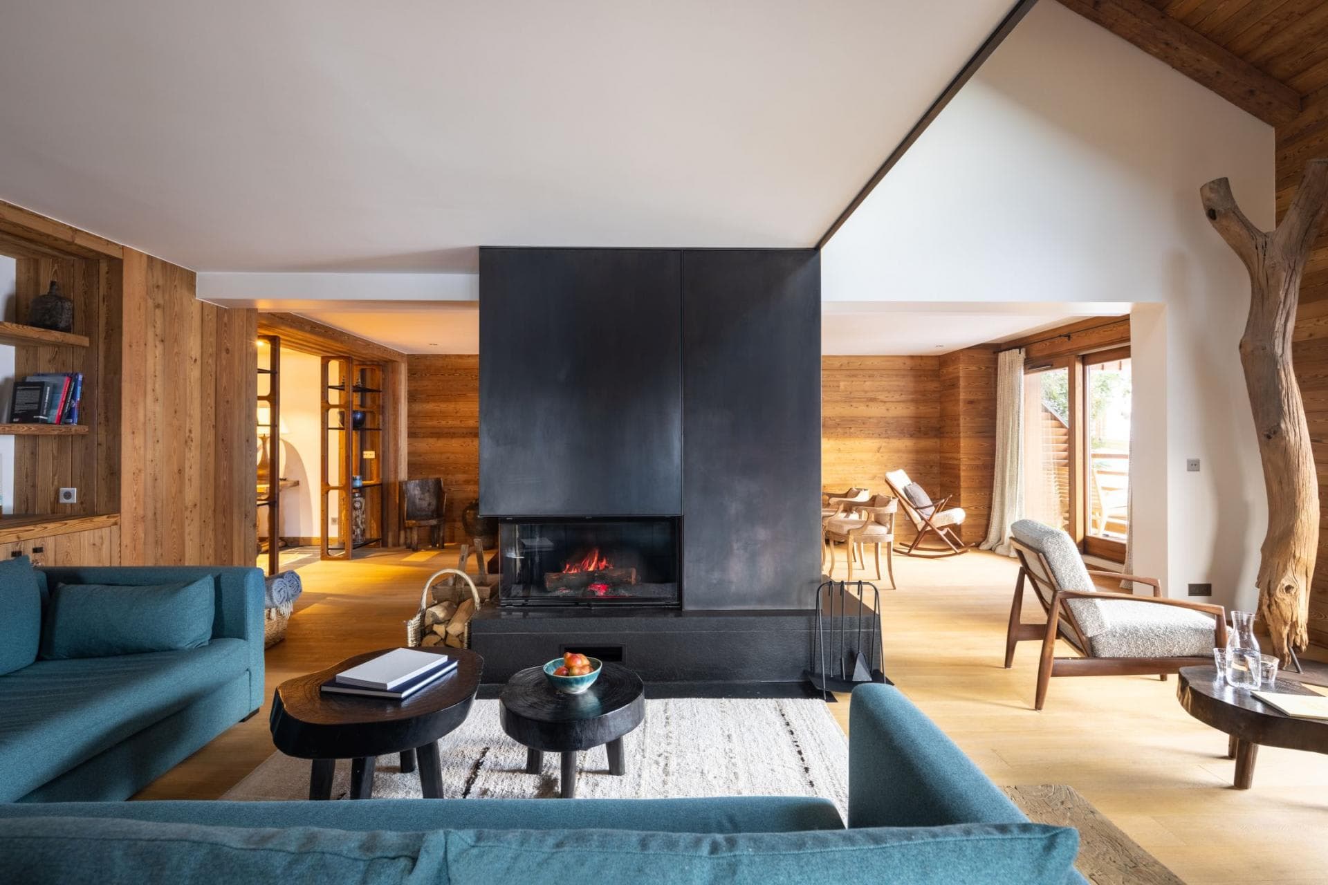 Living area with wood-burning fireplace and sectional sofa seating