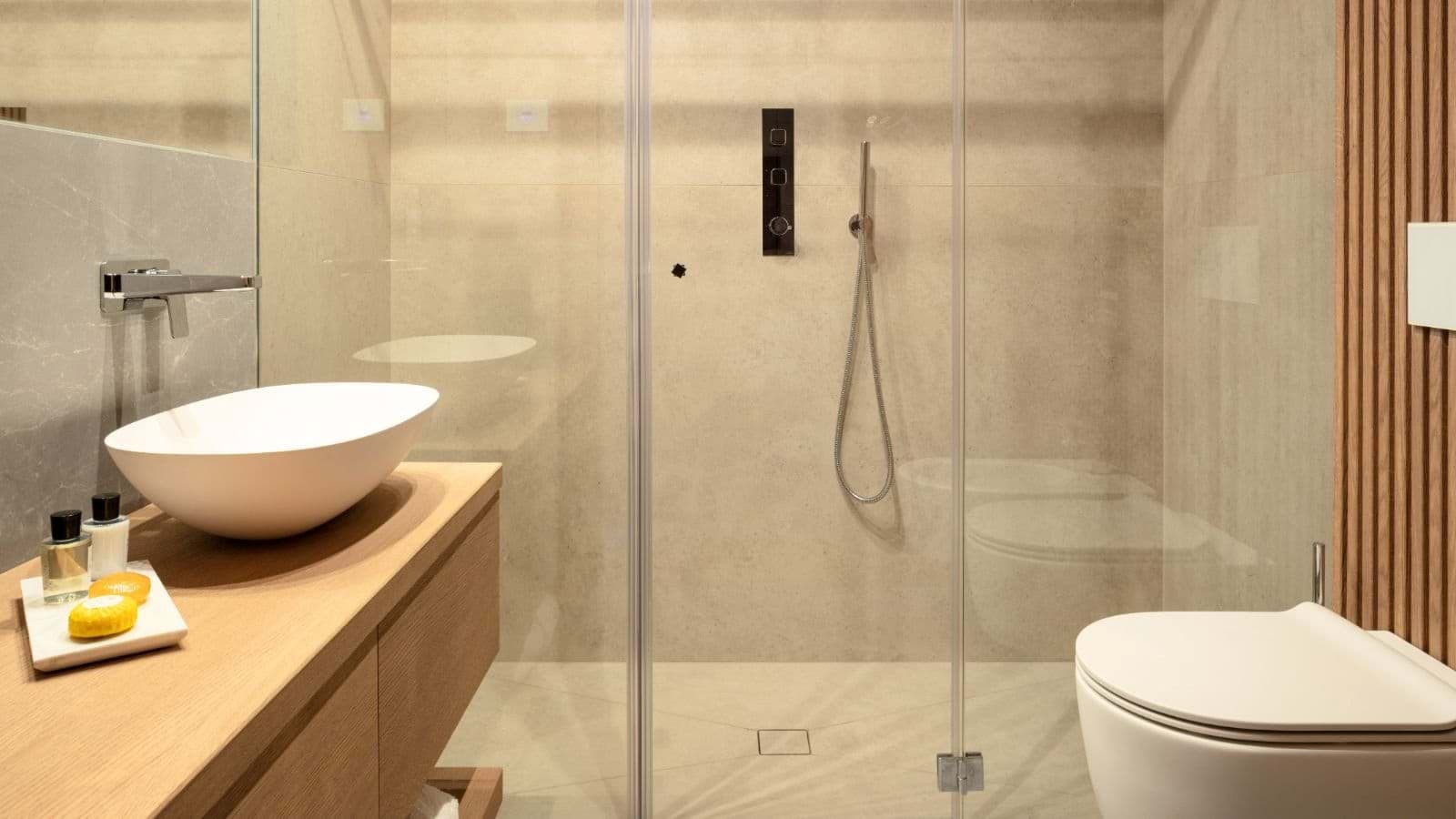 Bathroom with walk-in rainfall shower and vessel sink