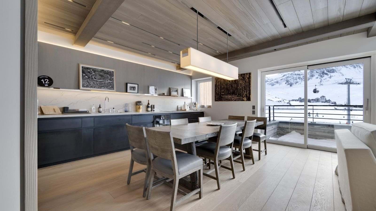 Dining area for 8 with mountain views and adjacent kitchenette