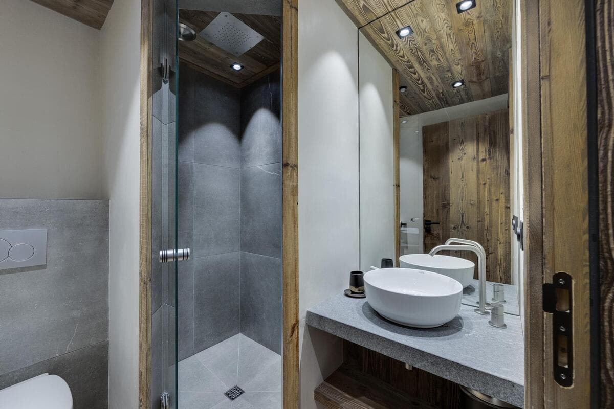 Bathroom with walk-in rainfall shower and vessel sink