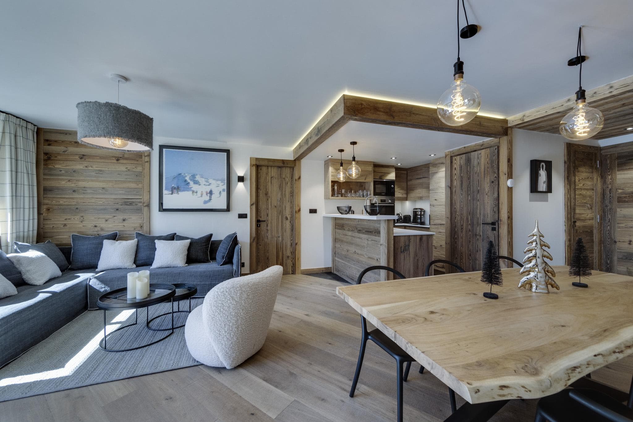 Open-plan living area with live-edge dining table and breakfast bar