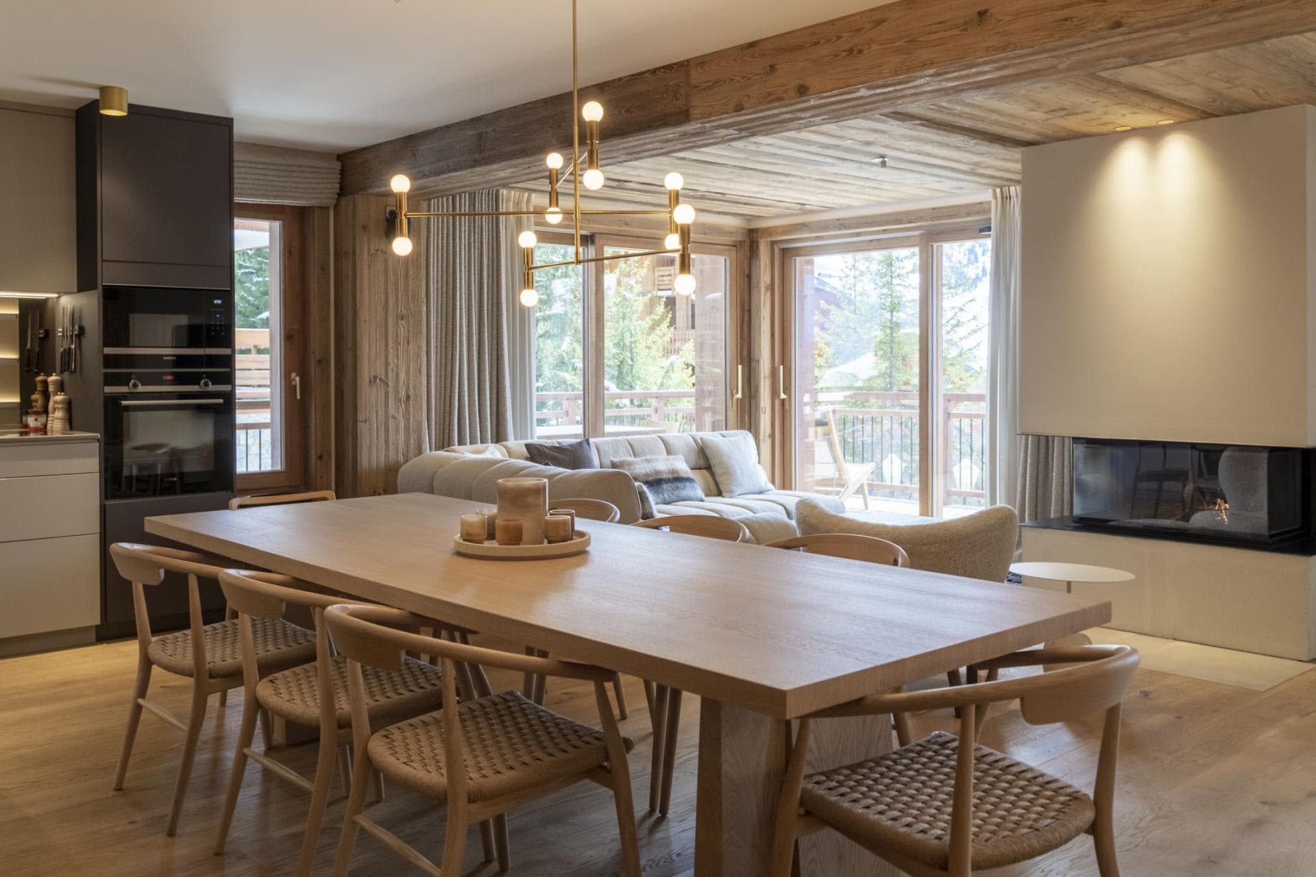 Open-plan dining area with seating for 8 and wood-burning fireplace