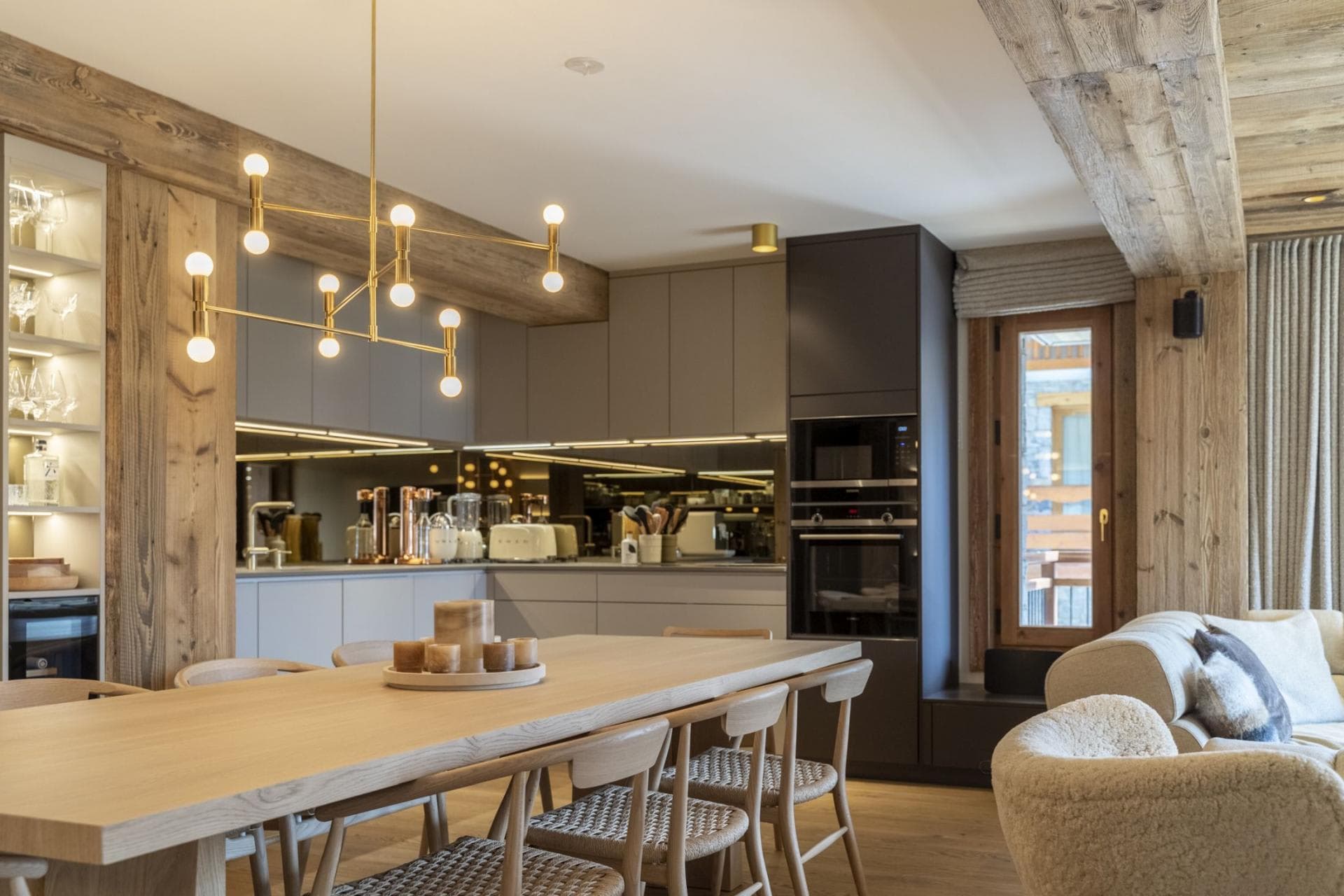 Open-plan dining area with seating for 8 and Smeg kitchen appliances