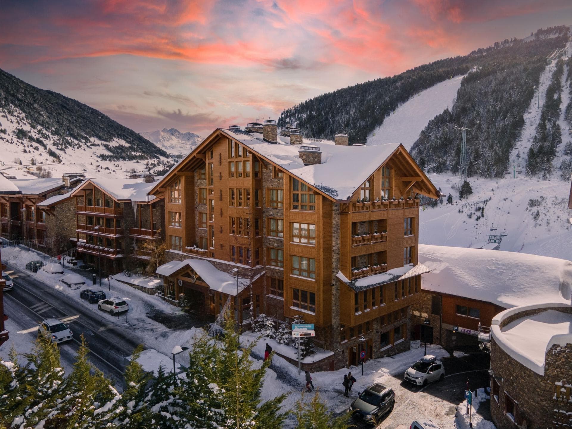 Ski lodge exterior with direct slope access and mountain views