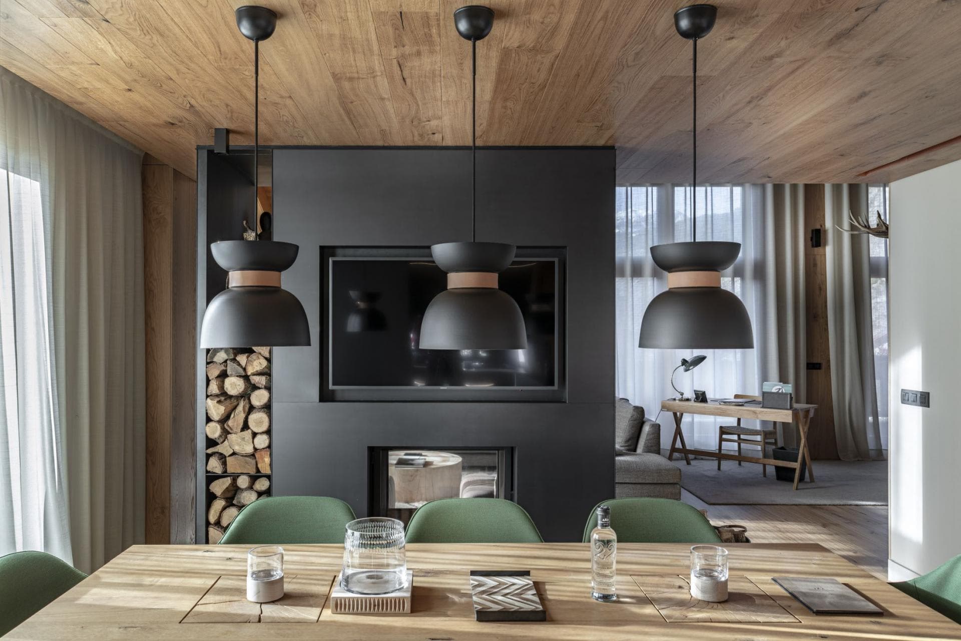 Dining area with double-sided fireplace and dedicated workspace