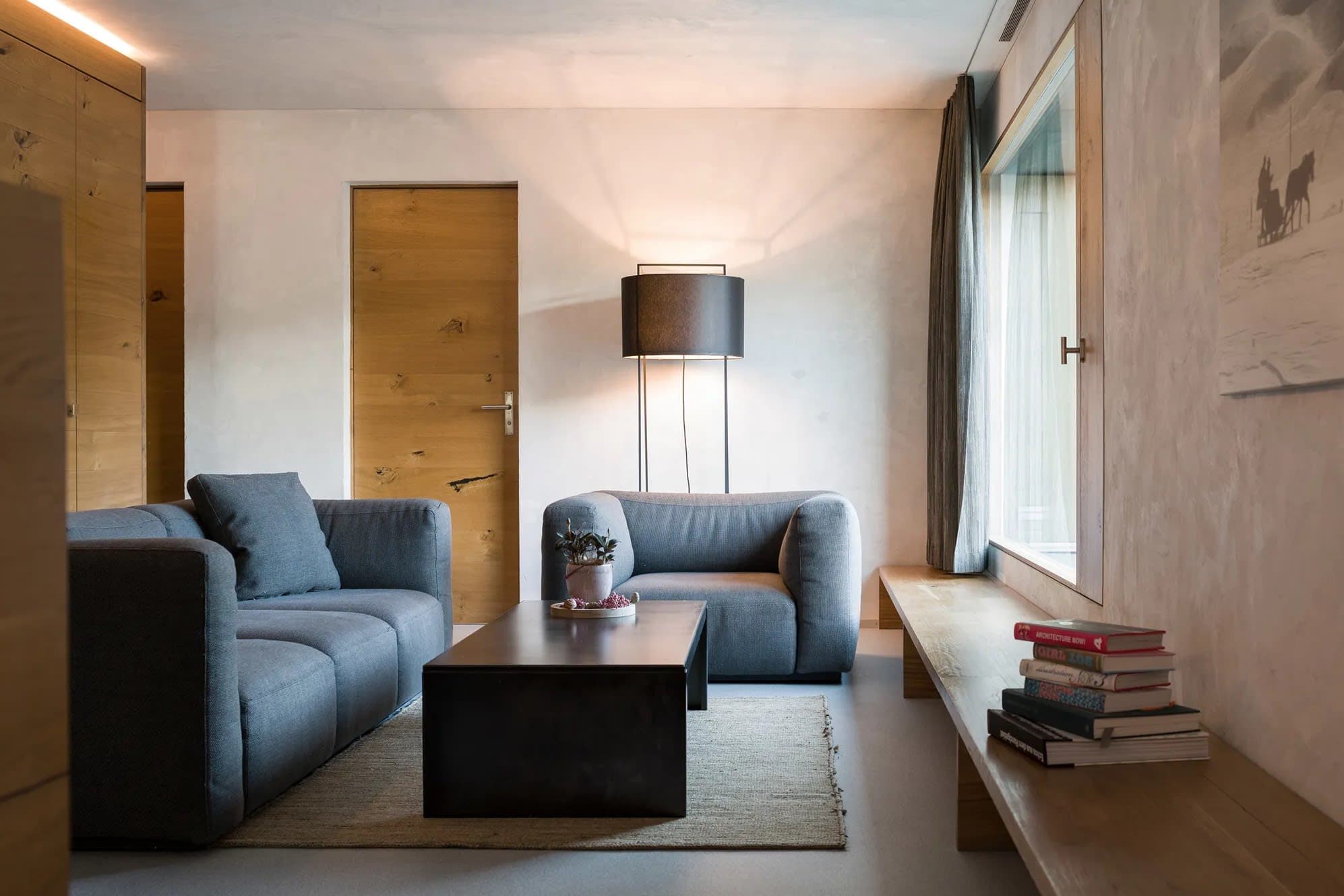 Living area with low-profile seating and integrated oak window bench