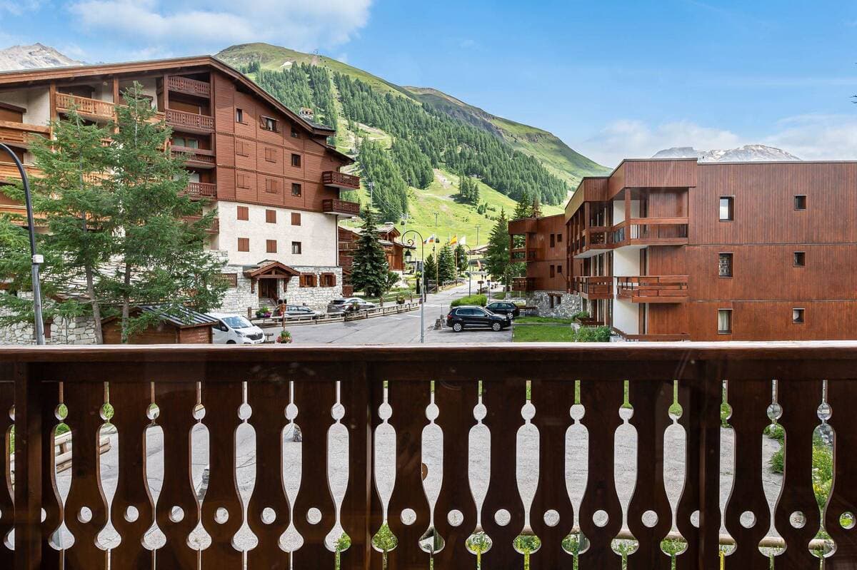 Private balcony with views of mountain slopes and resort village