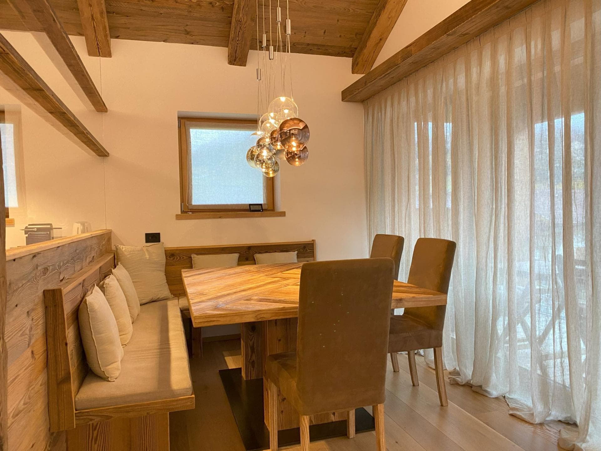 Dining area with booth seating and table for 6