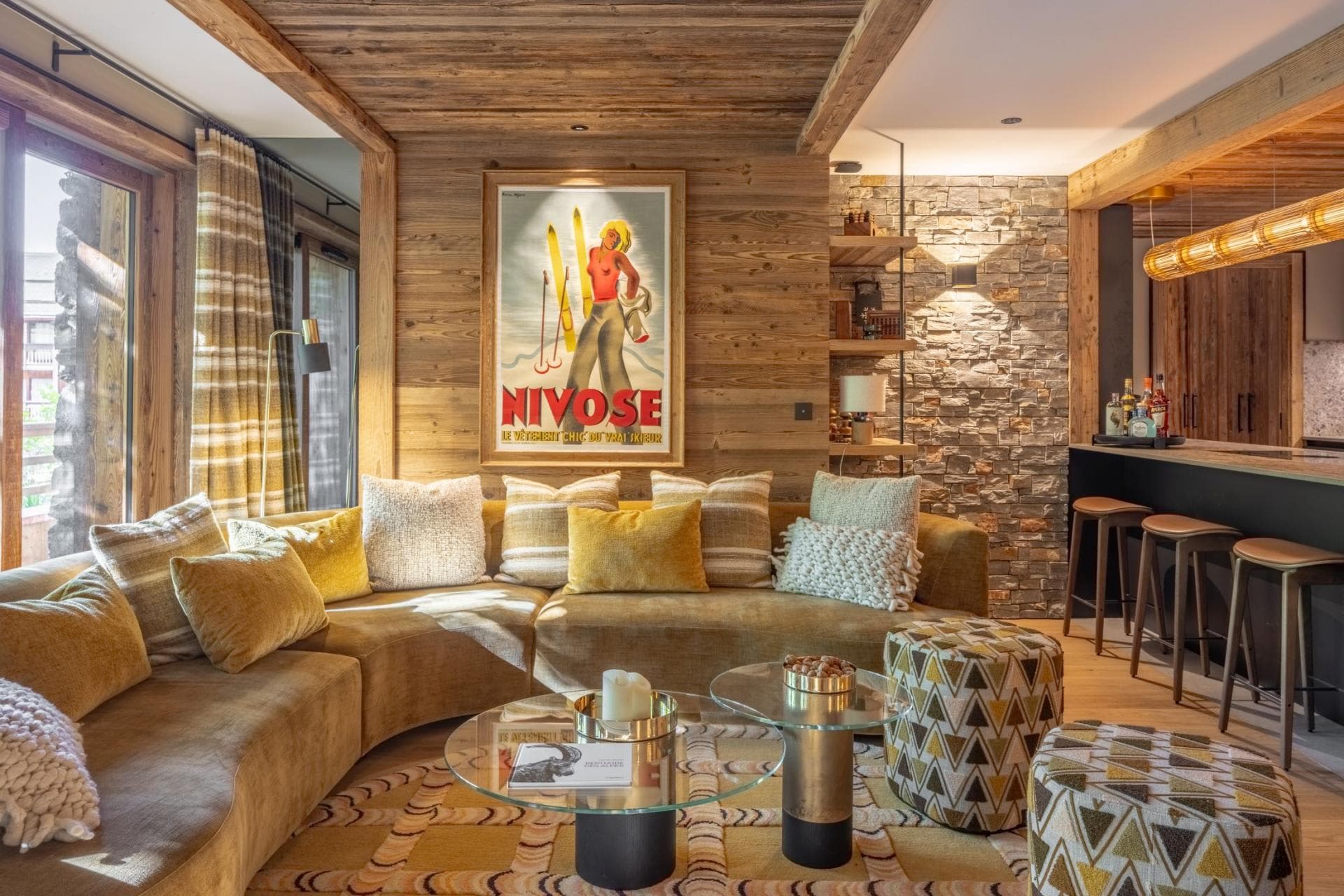 Living area with curved sectional seating and adjacent breakfast bar