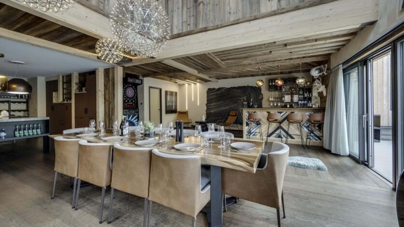 Dining area seats 10; adjacent wet bar and dart board