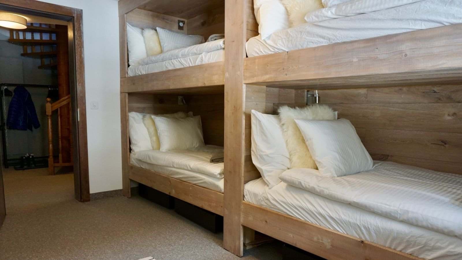 Bunk room with four twin beds and integrated reading lights