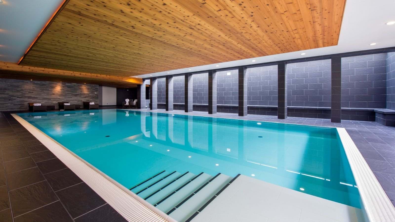 Indoor heated pool with cedar ceiling and walk-in steps