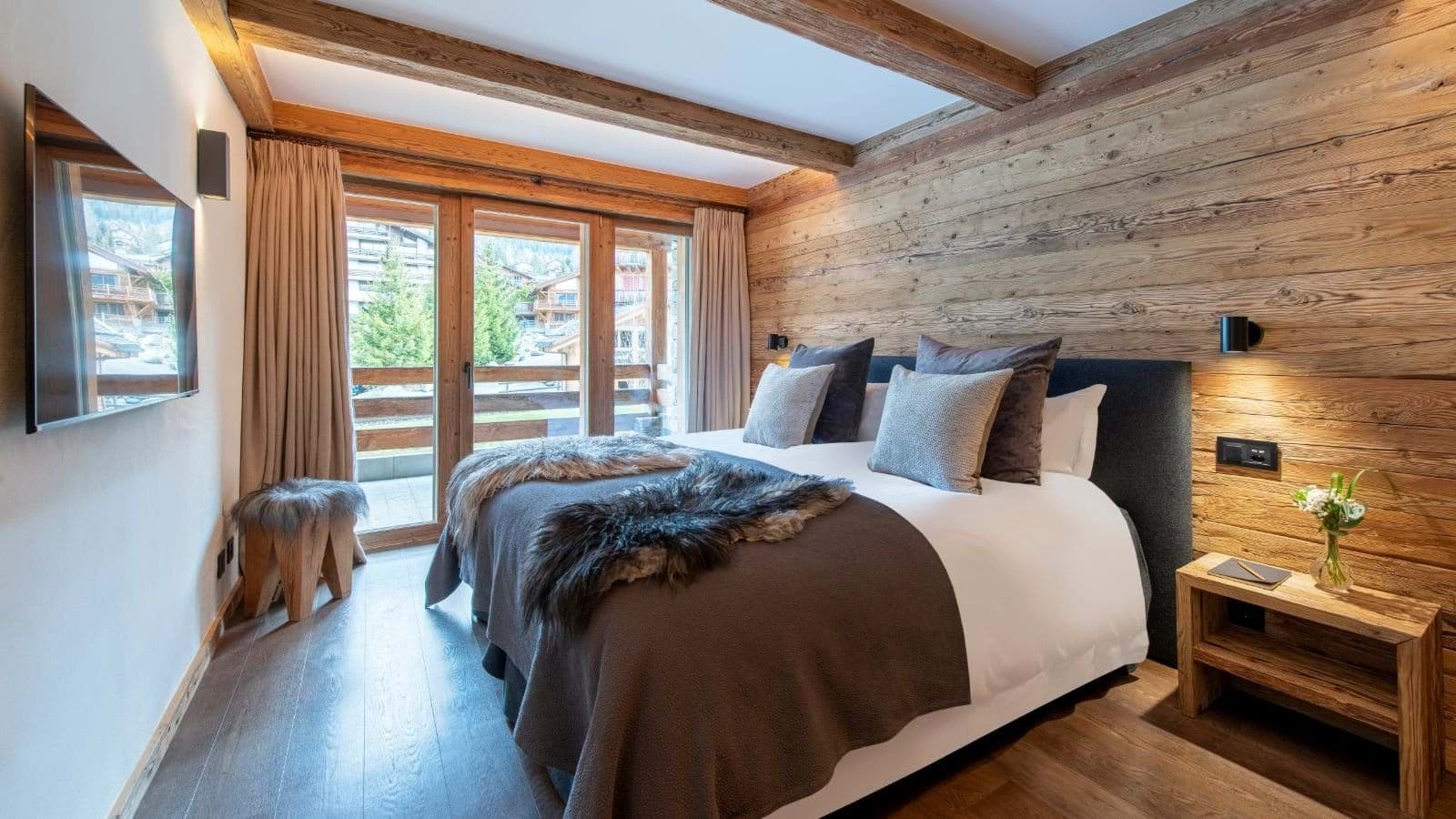Bedroom with king bed and private balcony access