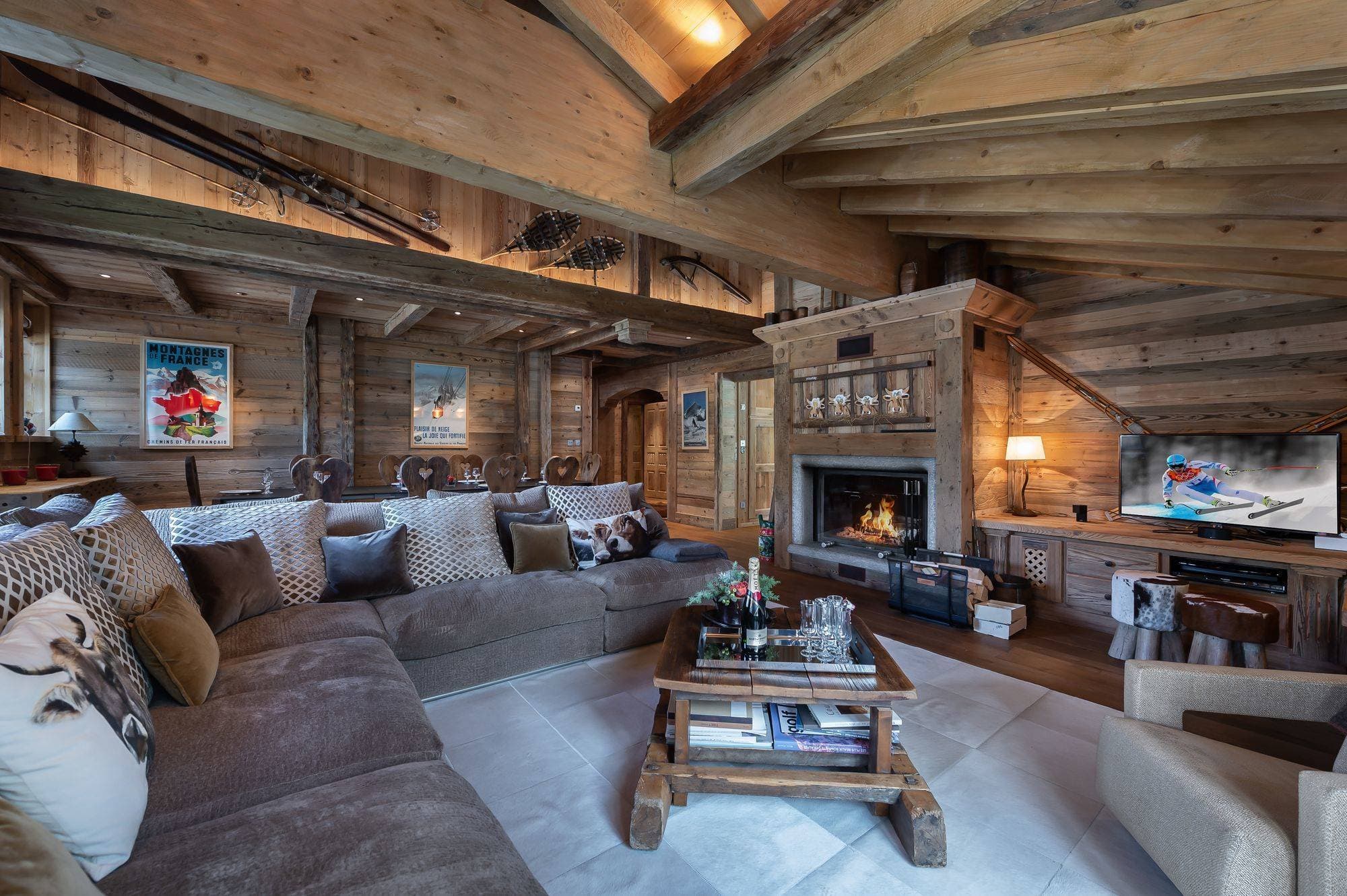 Living room with sofas beside a wood fireplace