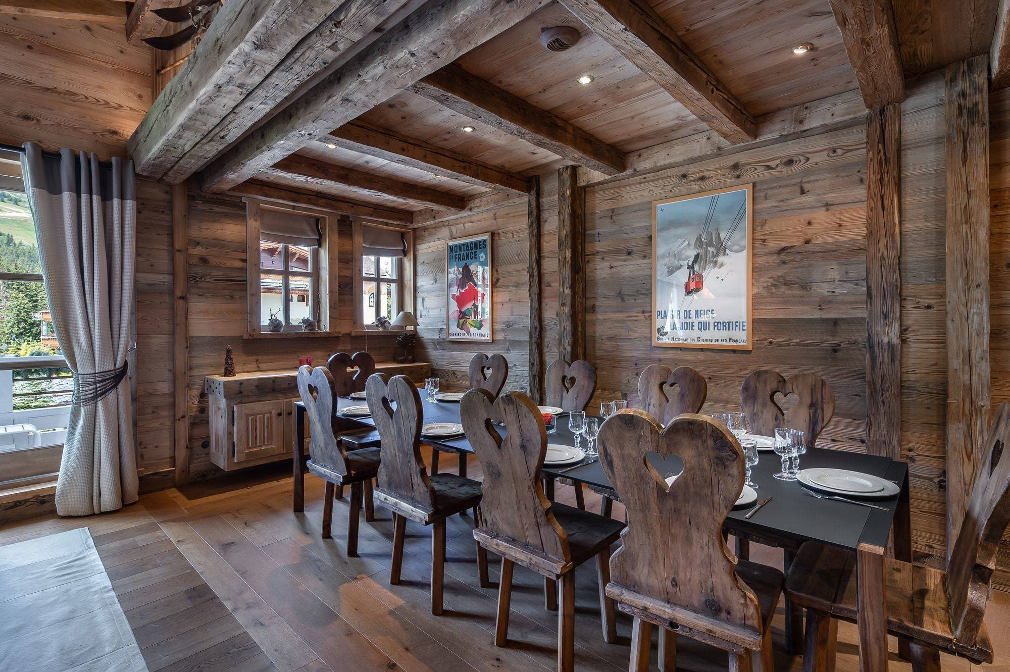 Dining area seats 10; exposed timber beams and wood-paneled walls