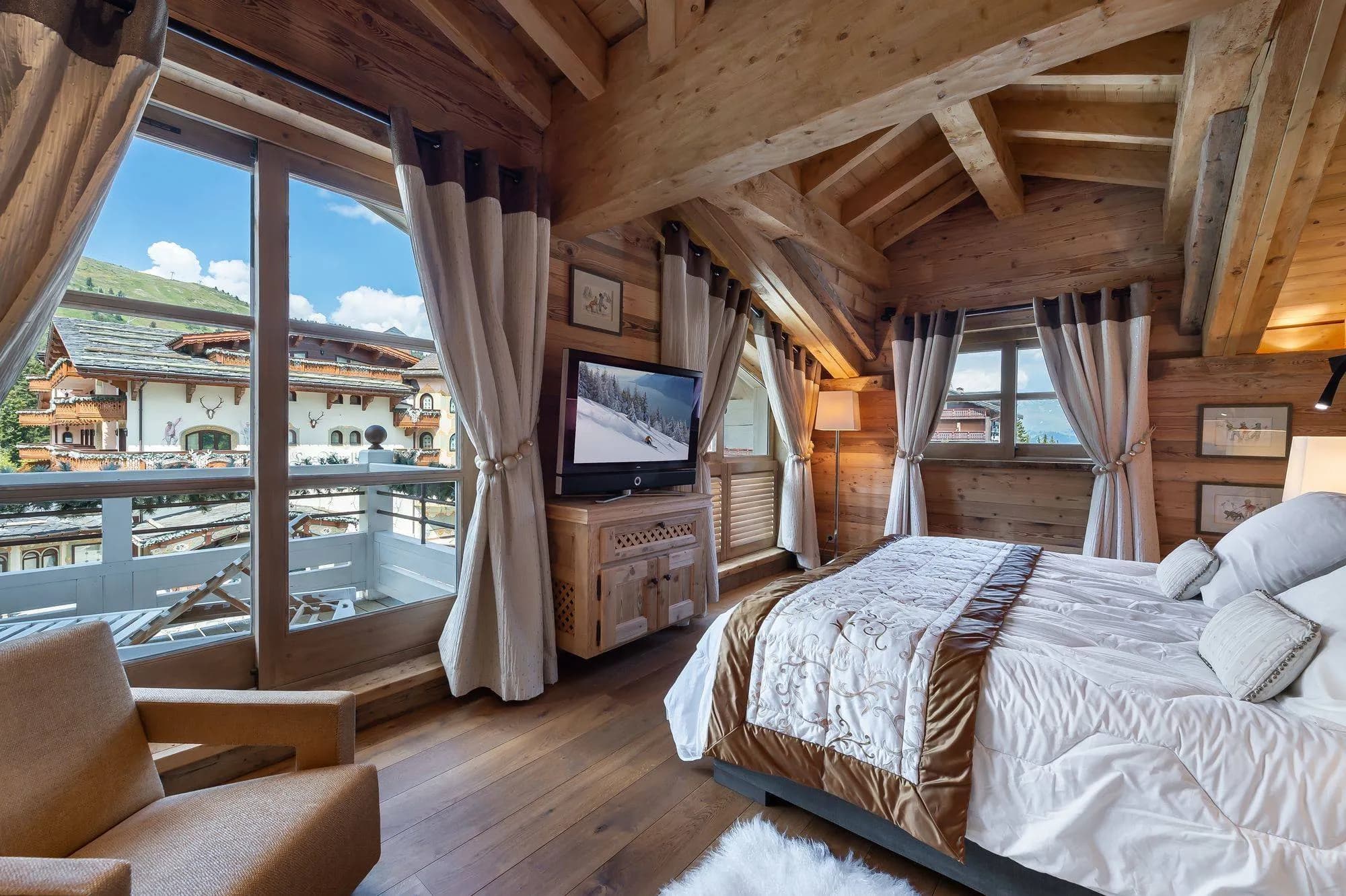 Double bedroom beside glazed balcony doors