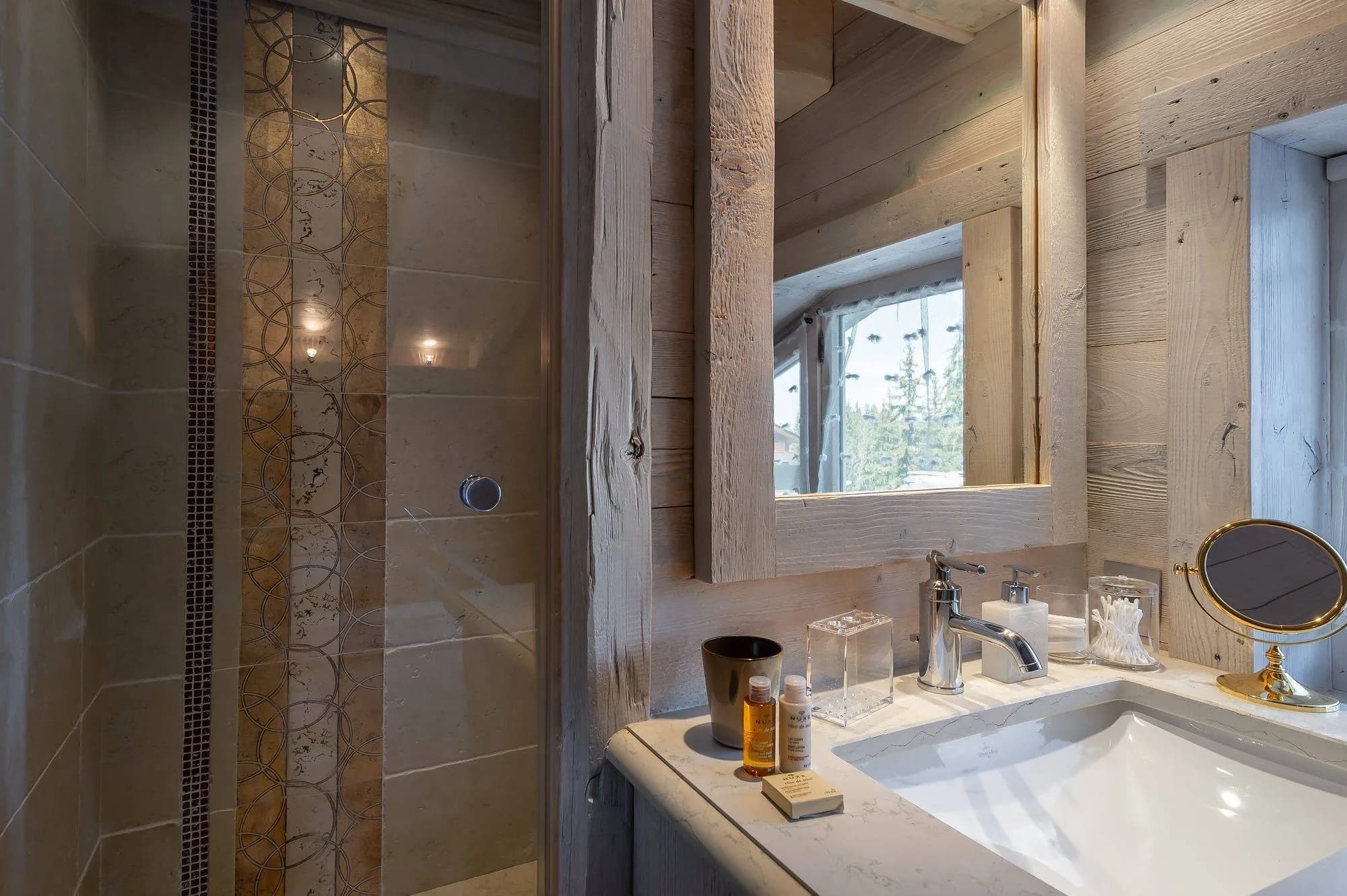 Bathroom vanity beside a window and shower