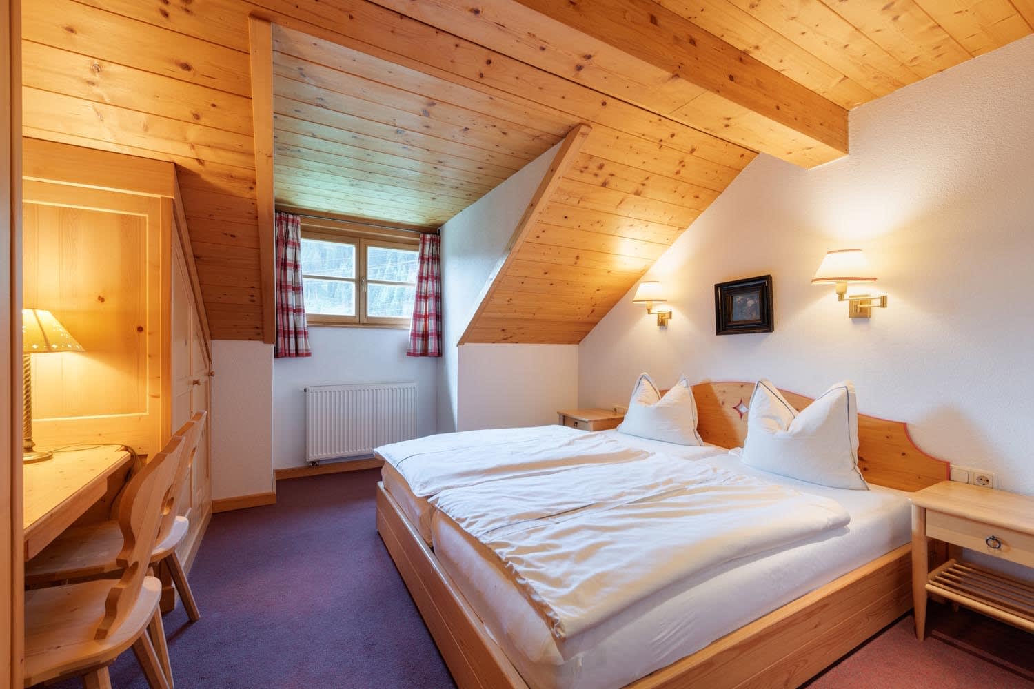 Guest bedroom with king bed and built-in workstation