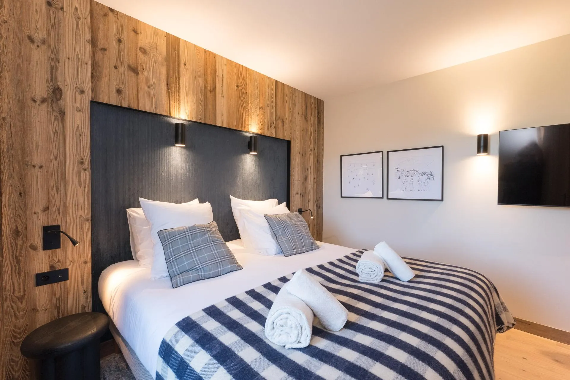 Double bedroom with timber feature wall and television