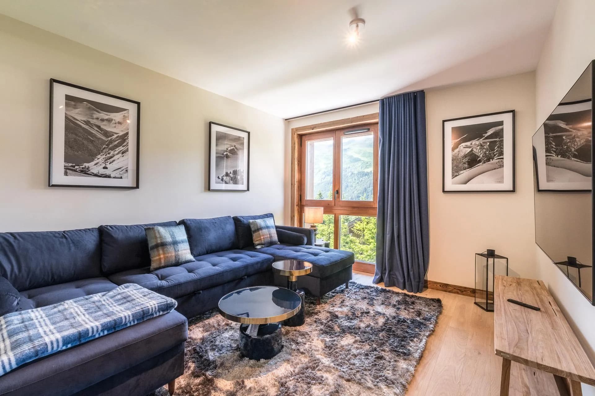 Living room with sectional seating and mountain views
