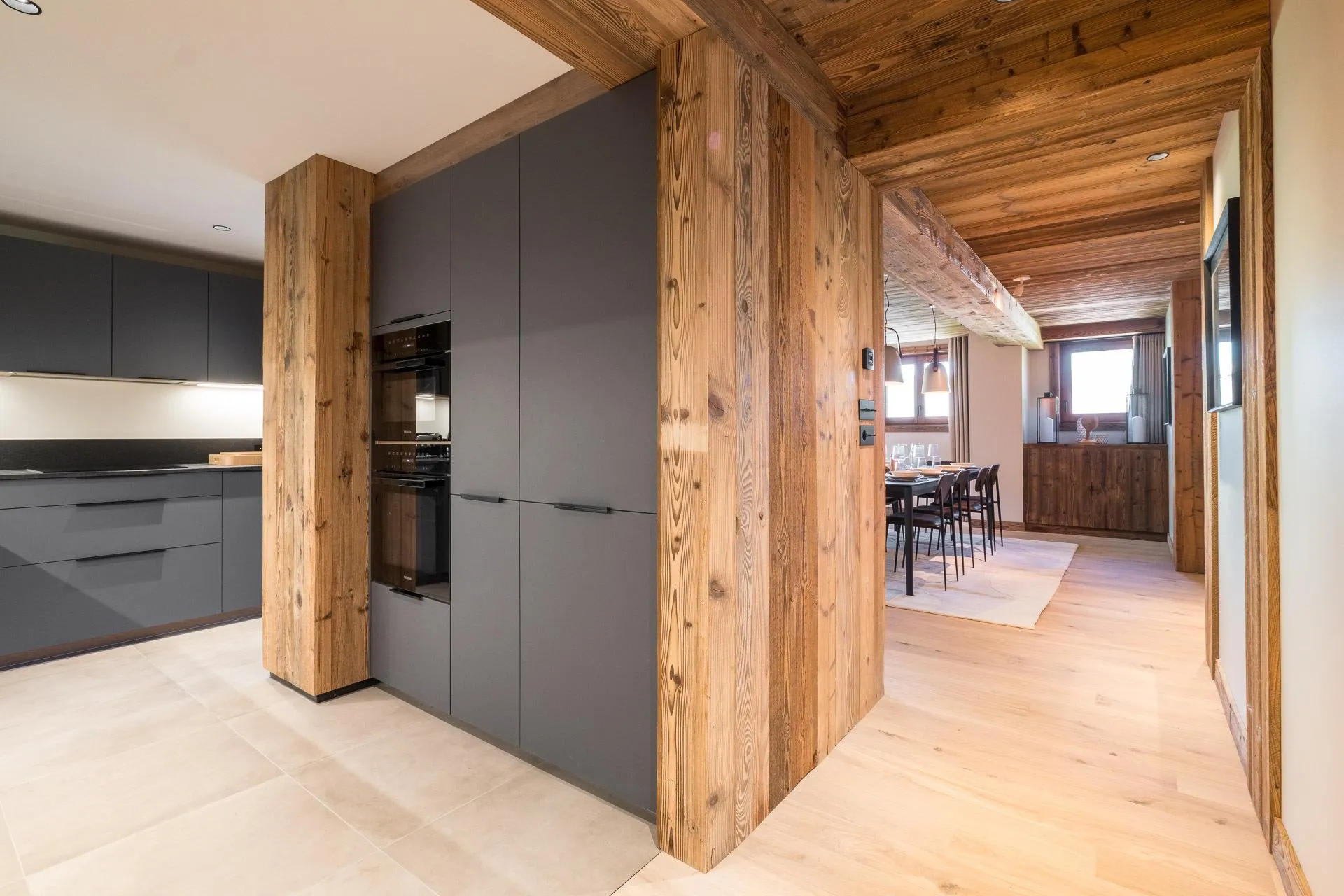 Fitted kitchen with double wall ovens and timber accents