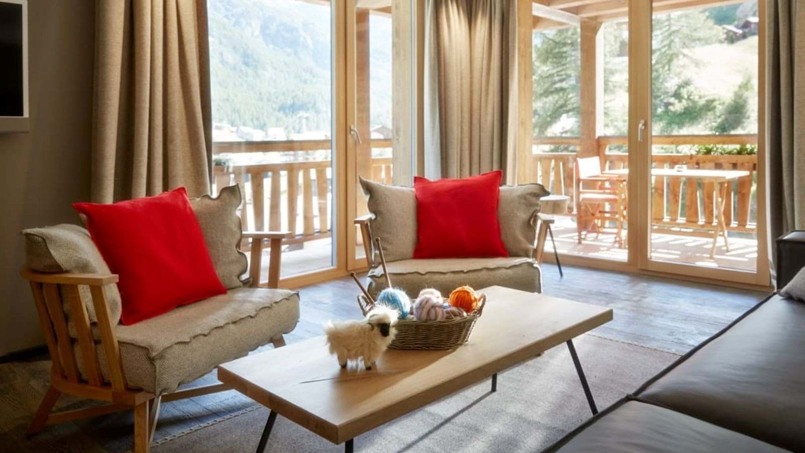Living area with floor-to-ceiling windows and private balcony access