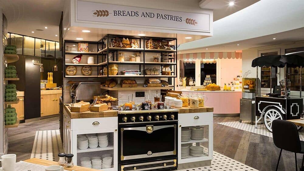 Breakfast buffet area with La Cornue range and fresh pastry station